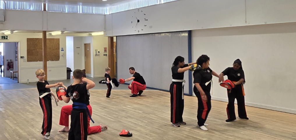 Students practising pad work drills