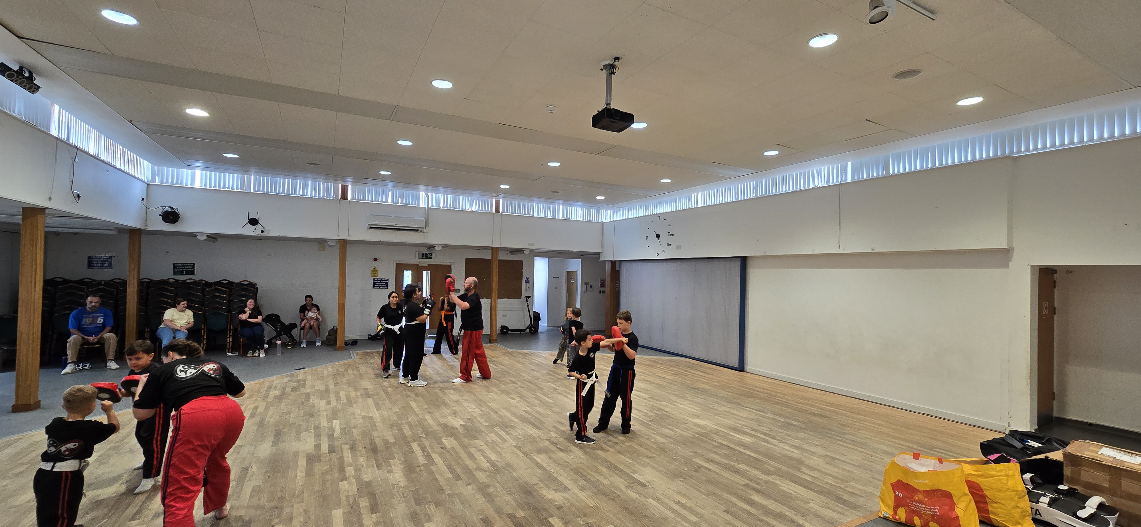 Pad work drills across the hall
